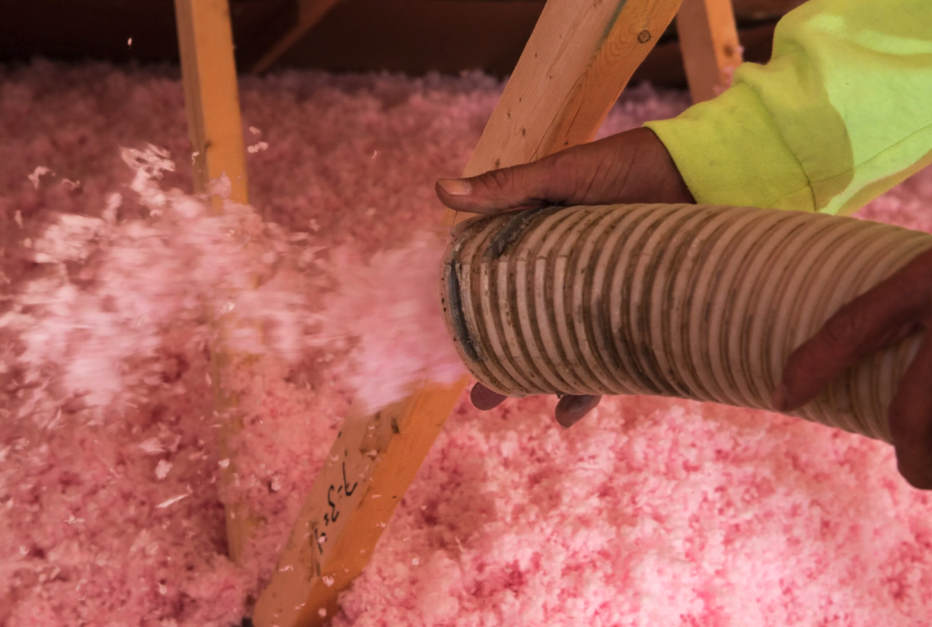 Blown-in fiberglass attic insulation installation for Houston TX homes