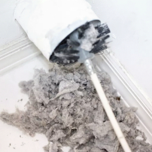Professional dryer lint removal from clogged vent in Houston TX home