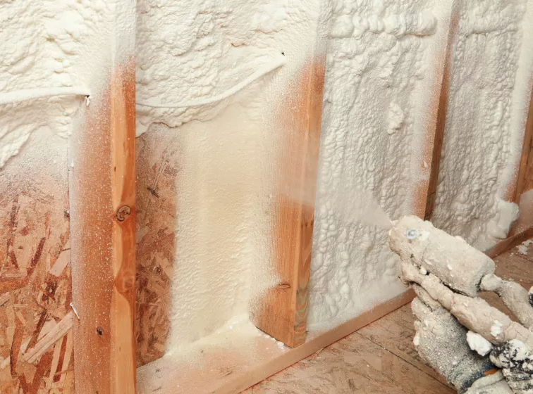 Spray foam insulation application on roof deck in Houston TX attic